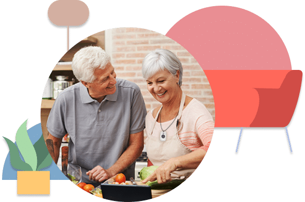 senior-couple-cooking-pers Senior couple cooking while wearing pers device