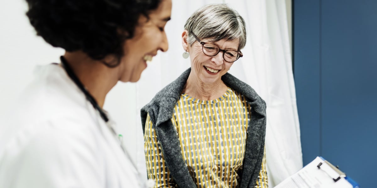 Women being given advice by female doctor